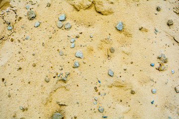 Pile of yellow sand texture. Construction Supplies. Sand pile with small stones