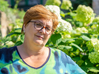 Mature woman walking on a Sunny day in the Park