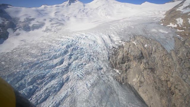 Aerial: Flying Over Awesome Glacier in Stunning Mountains on a Sunny Day, Mendenhall Glacier, Alaska