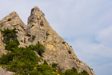 Fototapeta na wymiar mount peak on a blue cloudy sky backgrouns
