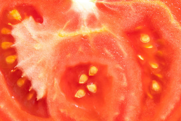 close up core with seeds of red tomato, macro, background, texture