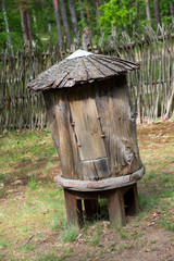 Fototapeta premium antique round wooden beehive for bees