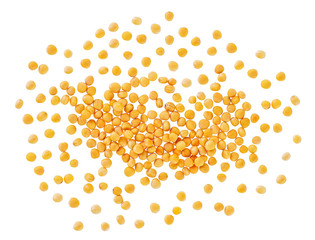 Pile of dry aromatic yellow mustard seeds isolated on white background, top view.