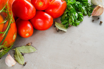 Preparation marinated conservation tomatoes with herbs, garlic, salt, and spice.