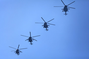 Kyiv, Ukraine - August 24, 2018: Helicopters (military multipurpose Mi-8) in the sky during the military technique parade in Kiev. Independence day celebration. Military equipment of the armed forces 