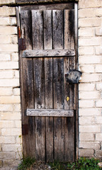 Old Halloween spooky wooden door with a hidden lock