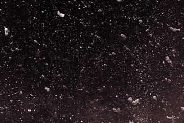 Artistic cosmos themed black textured dark wall background