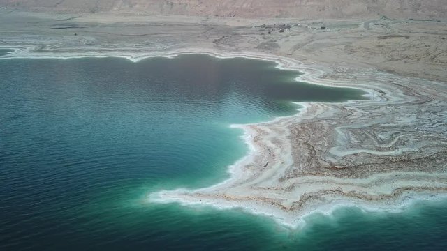 Dead sea coast at sunrise aerial view Drone footage of dead sea shore at sunrise in Israel