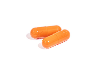 tablets orange, isolated on a white background. medicine.
