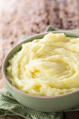 Fresh homemade creamy mashed potato in bowl (Selective Focus, Focus in the middle of the potato...