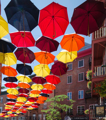 Colored Umbrellas Suspended Over Street in Quebec City