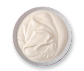 White yogurt in ceramic bowl on isolated background.
