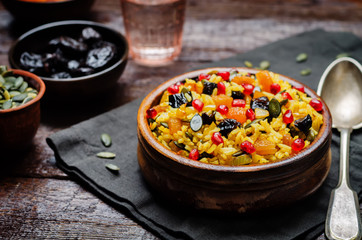 Jeweled Rosh Hashanal rice on a wood background