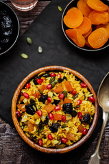 Jeweled Rosh Hashanal rice on a wood background