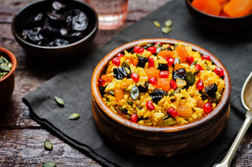 Jeweled Rosh Hashanal rice on a wood background
