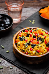 Jeweled Rosh Hashanal rice on a wood background