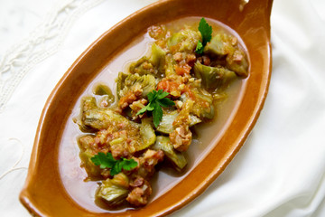 Arichokes with ham. Spanish traditional tapa.