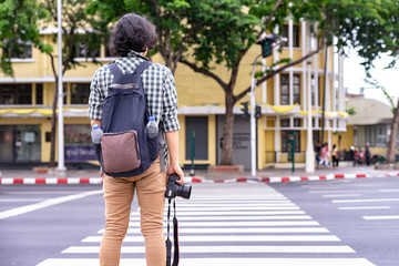 young man walking on the street