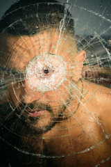 damage. sexy hispanic man broken mirror. anger. destruction. crush test. theft. emotional...