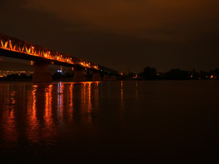 View on the Danube river and the Train bridge in Budapest Hungary after sunset