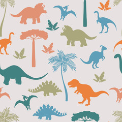 Seamless pattern with colorful dinosaur silhouettes © Elvira