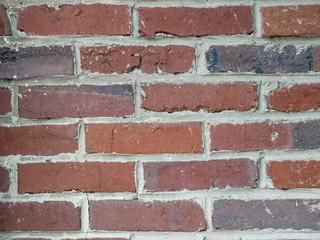 Naklejka premium Mur de briques rectangulaires de differents tons rouges