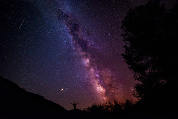Fototapeta na wymiar The Milky Way crossing the sky over a guy