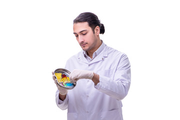 Young handsome doctor with syringe isolated on white