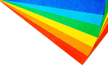 Composition of various colorful sheets of cardboard on a white background. Top view, copy space