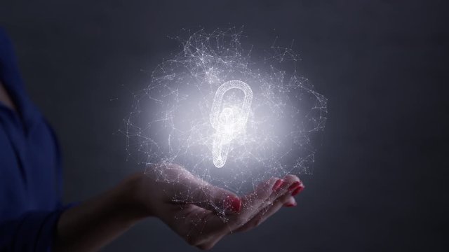 Blockchain glowing hologram symbol on the hand. Shot on RED.