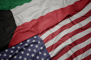 waving colorful flag of united states of america and national flag of kuwait.
