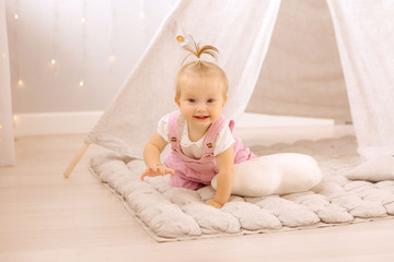 baby girl playing in the nursery, baby learning to walk, textiles for the nursery., tent in the children's room