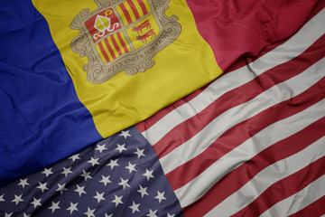 Obraz premium waving colorful flag of united states of america and national flag of andorra.