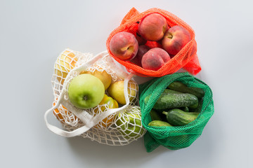 Three shopping textile bag with fresh fruits and vegetables. Zero waste concept.