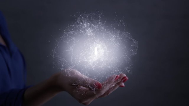 Hackhaton. Futuristic glowing hologram is over the palm and hand of woman. Technology connectivity concept. Shot on RED film camera.