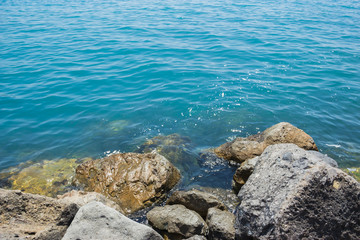 Fototapeta na wymiar View of the blue water of the Black sea and coastal cliffs on the coast