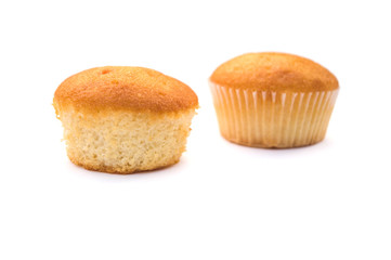 two Christmas cupcakes in pink, decorated with yellow and pink stars and a candy stick on the top, on a white background.