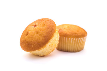 two Christmas cupcakes in pink, decorated with yellow and pink stars and a candy stick on the top, on a white background.