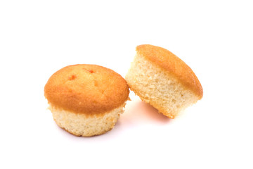 two Christmas cupcakes in pink, decorated with yellow and pink stars and a candy stick on the top, on a white background.