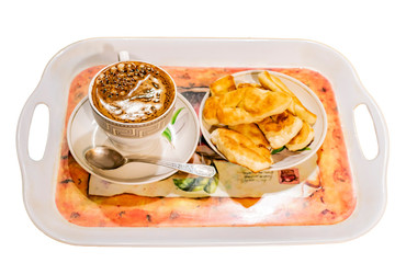 Two cups of coffee and cookies on a tray