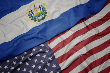 waving colorful flag of united states of america and national flag of el salvador.