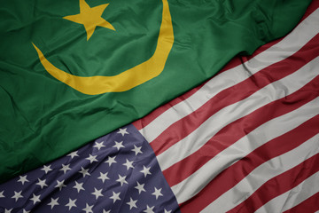 waving colorful flag of united states of america and national flag of mauritania.
