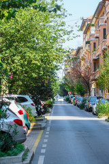 Fototapeta premium Verona, Italy - July, 28, 2019: cars parked on the street in Verona, Italy