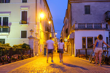 Adria, Italy - July, 11, 2019: one of the central streets of Adria, Italy, in the evening