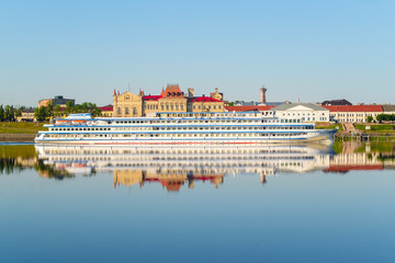 Rybinsk, Russia - June, 10, 2019: landscape with the image of a passenger ship on the Volga River, in the city of Rybinsk, Russia