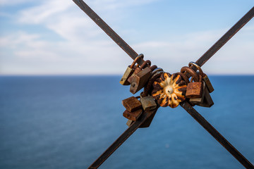 Locks of love on a rusty fence