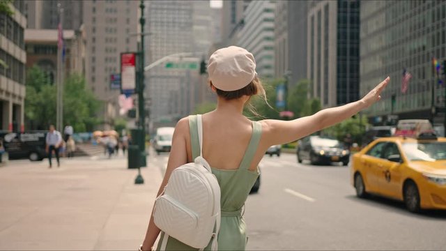 Parisian catching yellow cab (taxi), first time in new york, everyday life moment.