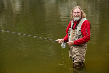 Flyfishing in forest during eco-tourism.