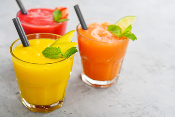 Fresh strawberry, mango and papaya smoothies