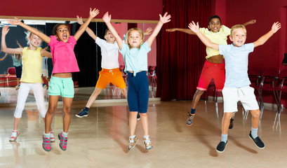 Little boys and girls jumping and having dancing class